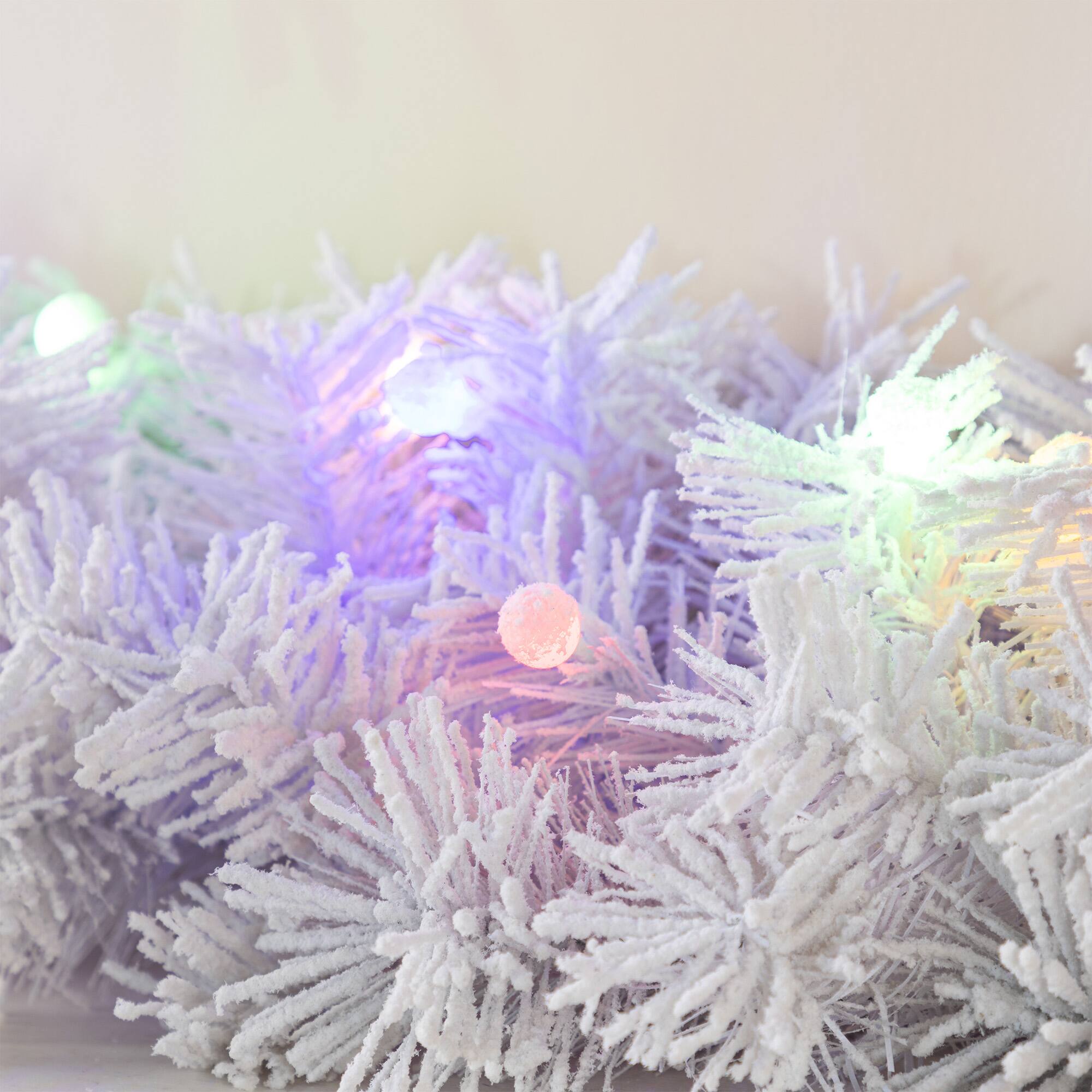 Glitzhome® 9ft Pre-Lit Snow Flocked White Pine Christmas Garland with Timer